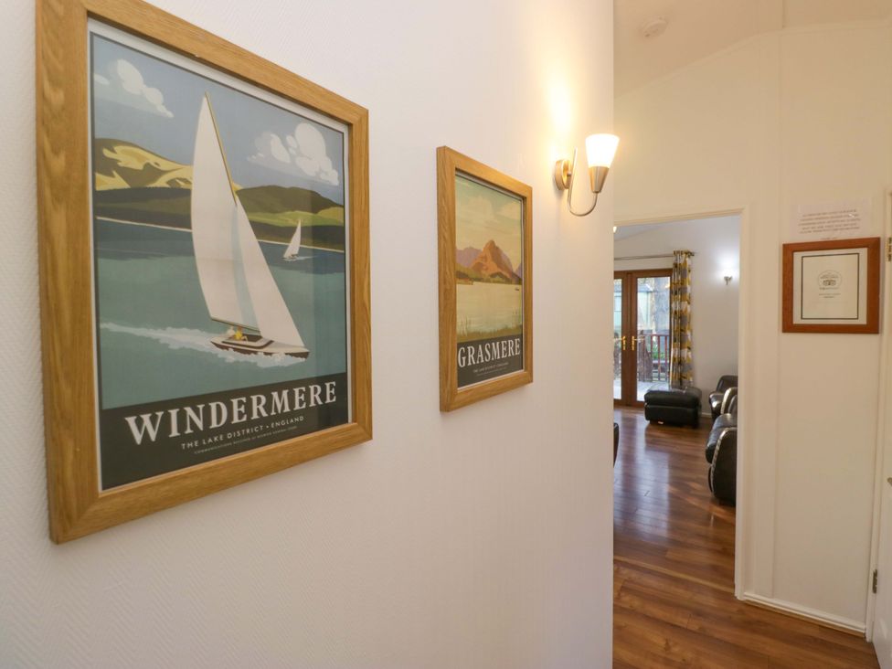 A hallway with framed posters at 6 Waterside Windermere