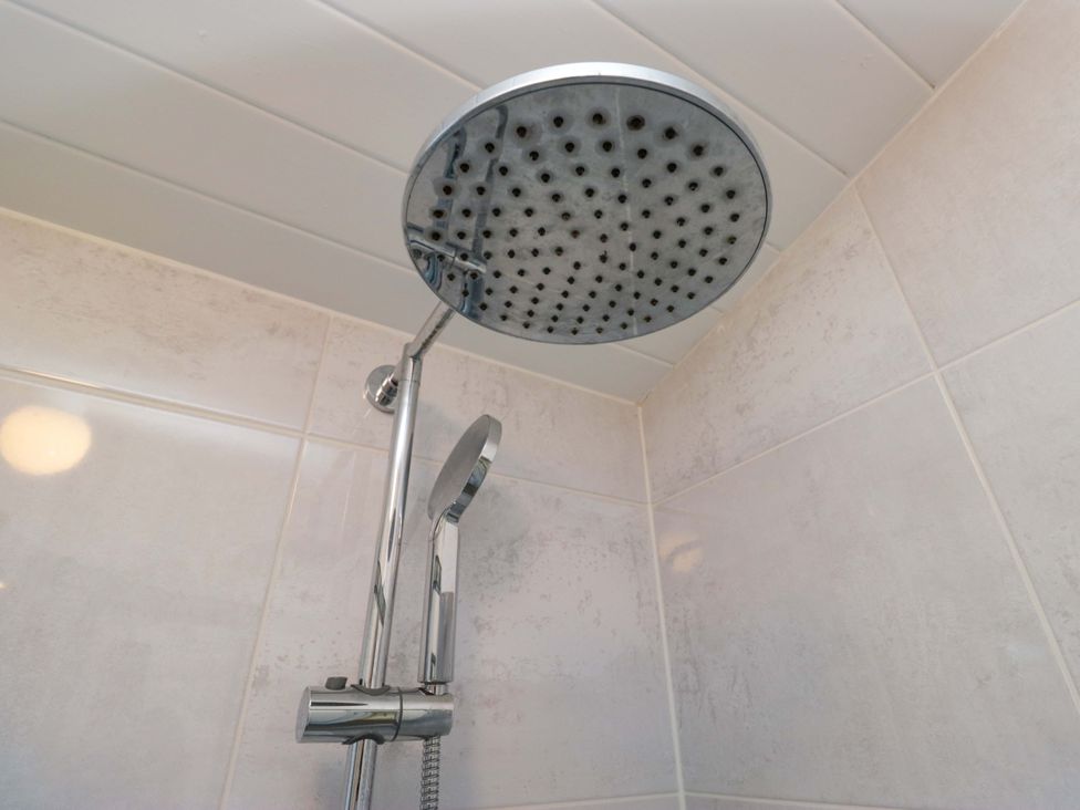 A shower head installed in a bathroom at 6 Waterside in Windermere