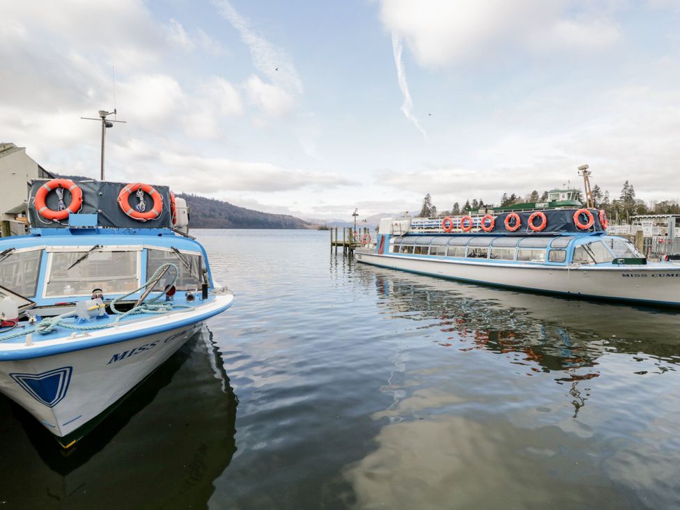 Two boats at a dock on a lake at 6 Waterside, White Cross Bay, Troutbeck Bridge
