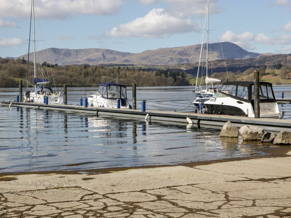 A dock with boats on water at 6 Waterside, White Cross Bay, Troutbeck Bridge