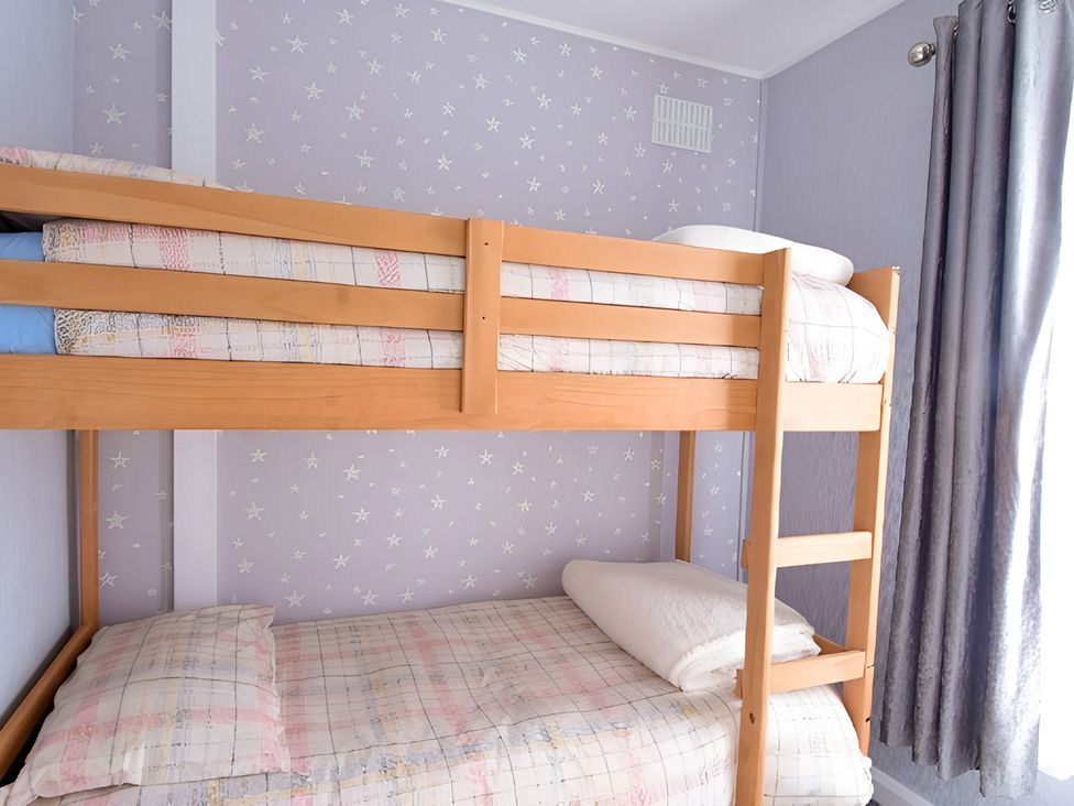 A bunk bed with pillows and bed linen at 226 Third Avenue in Bridlington