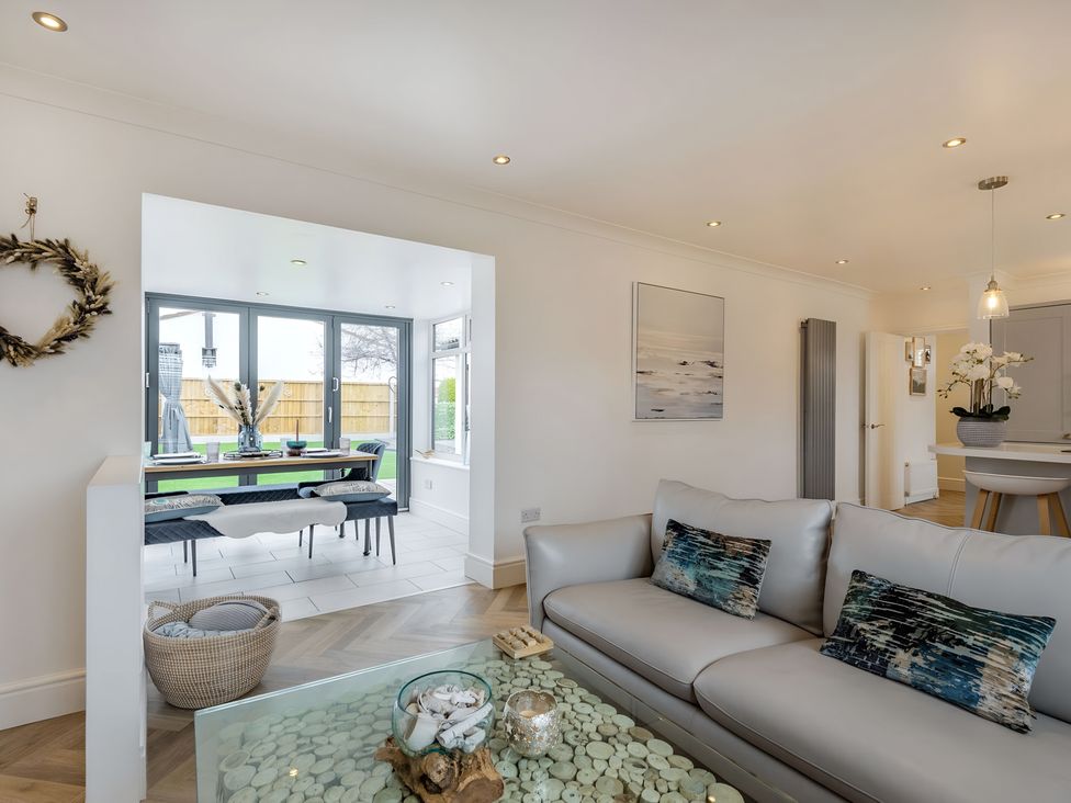 A living room with a sofa and coffee table at 6 Tegafan in Abergele