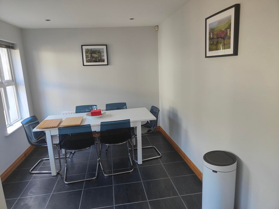 A dining room with a table and chairs at 17 Castleview in Ballymena
