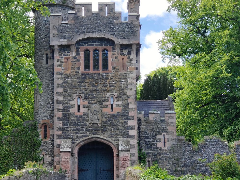 A stone tower structure with a large gate at 17 Castleview in Ballymena