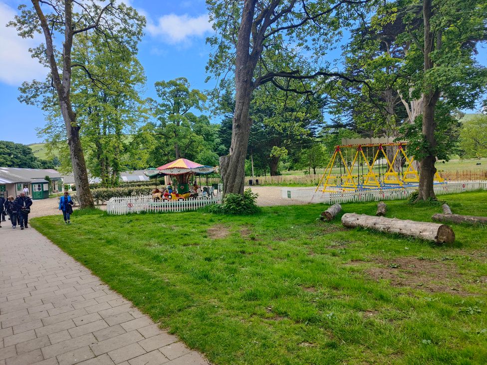 A park with trees and playground equipment at 17 Castleview Ballymena
