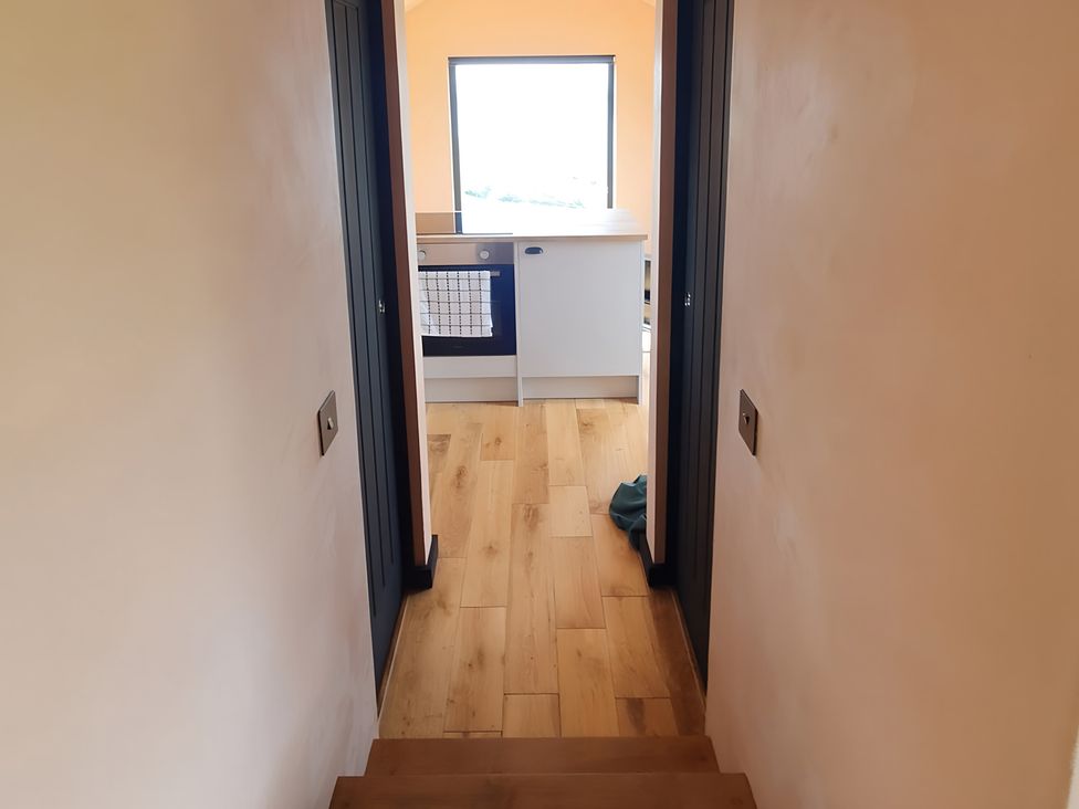 A view of a kitchen with stairs leading down at Cullinview Isle of Skye