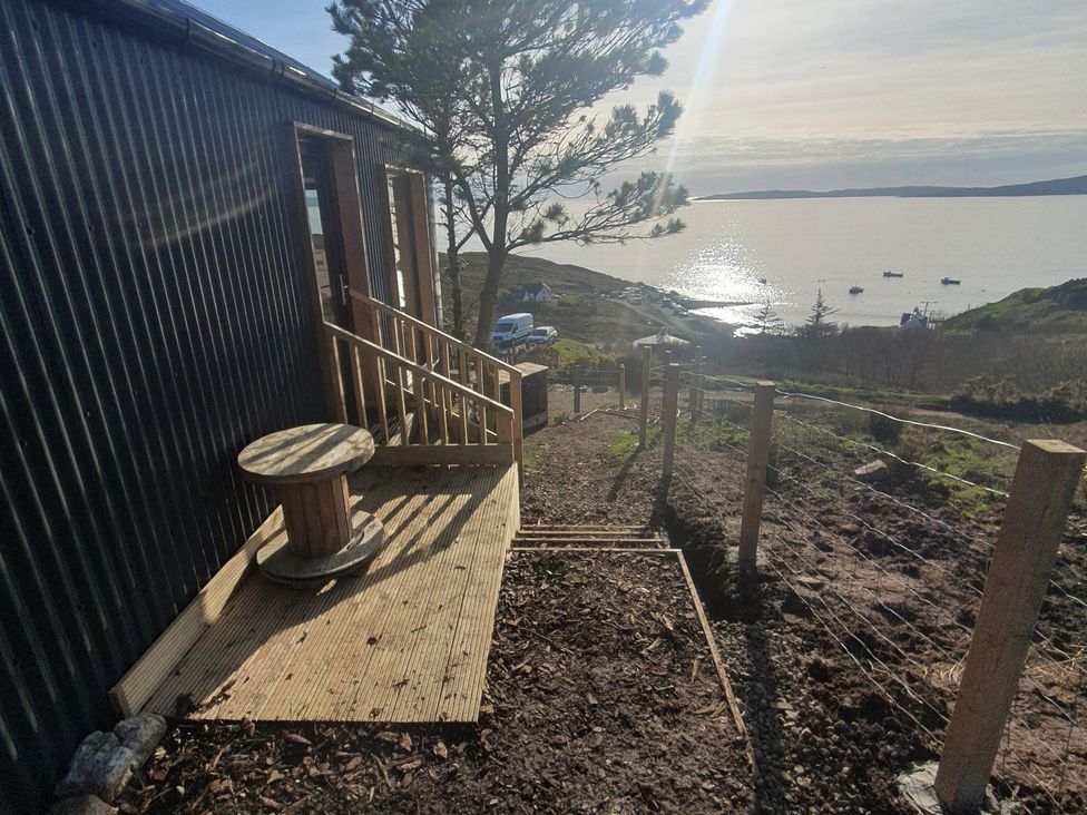 An outdoor area with a deck and views of the sea at Cullinview in Isle of Skye