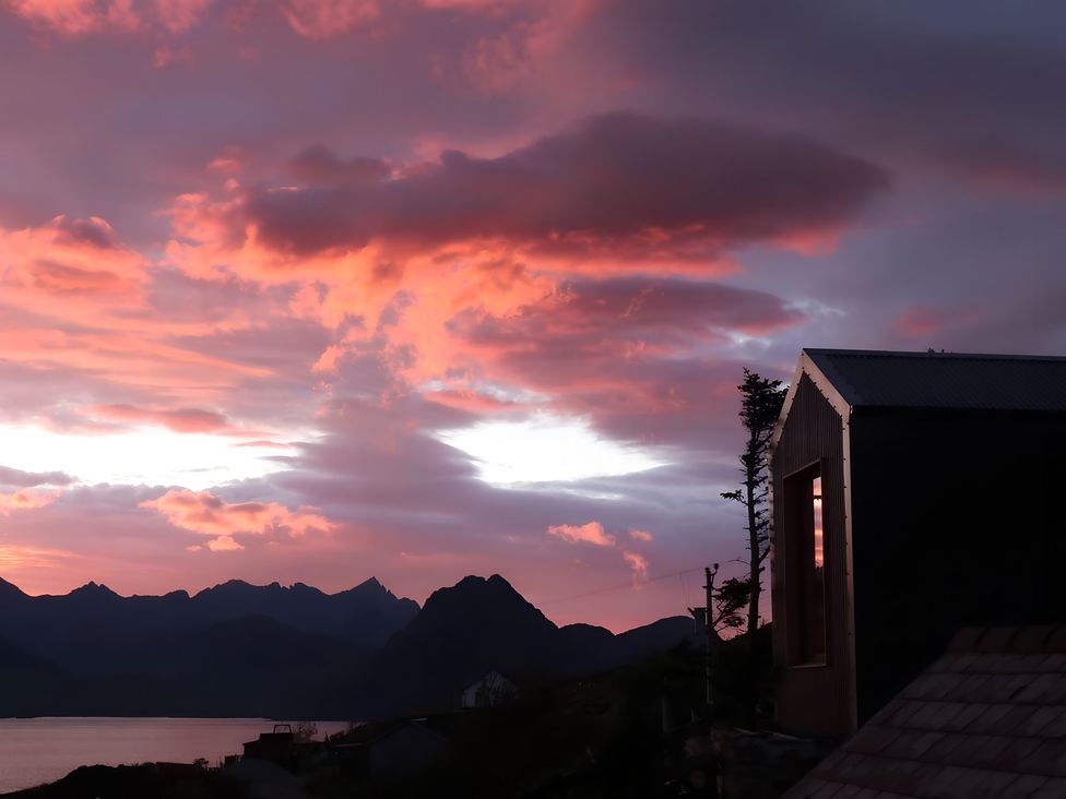 A landscape view with mountains and a building at Cullinview in Isle of Skye