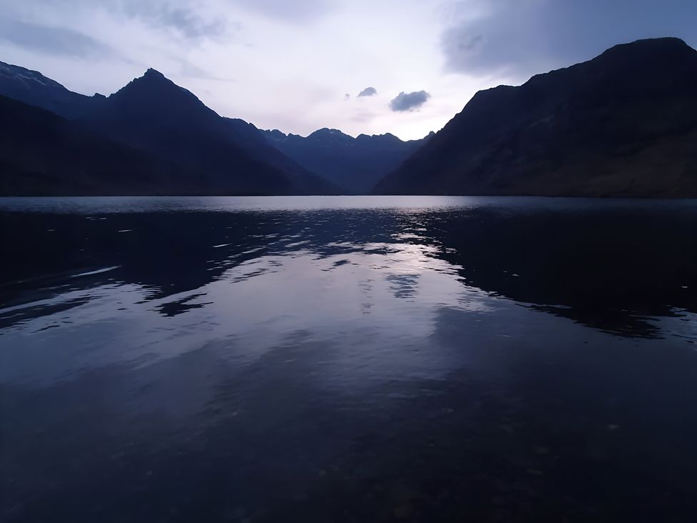 A lake surrounded by mountains at Cullinview Isle of Skye
