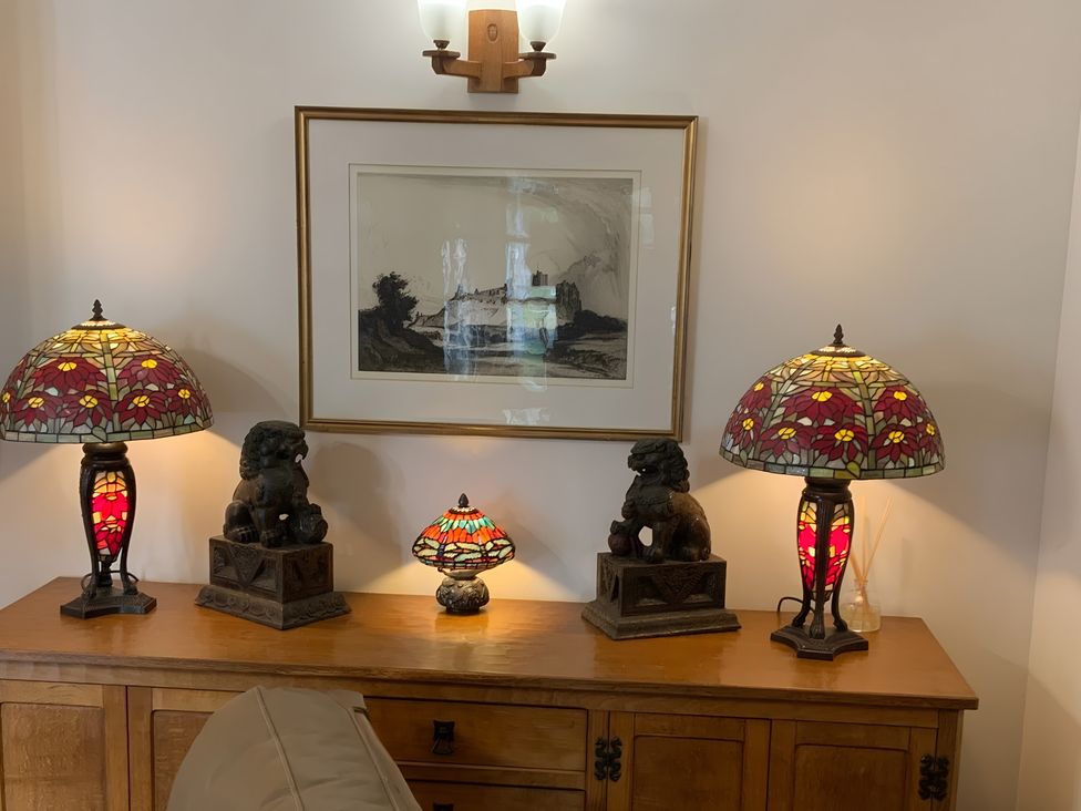 A living room with lamps and artwork at Fenton Drive Wooler