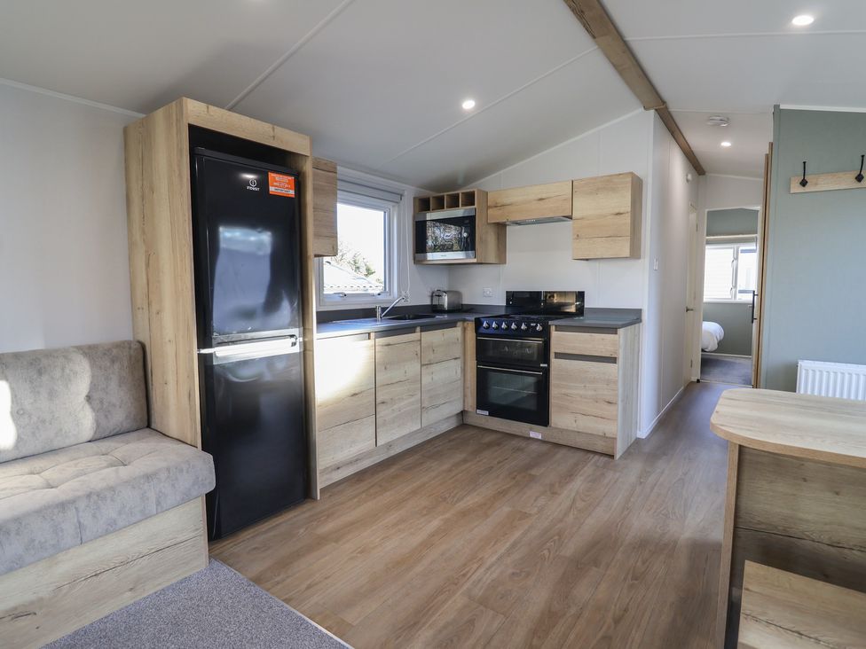A kitchen with a refrigerator and oven at WF32 - Jurassic Discovery in Charmouth