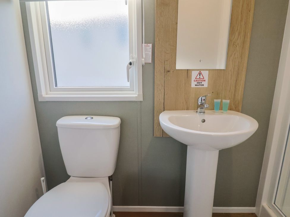 A bathroom with a toilet and sink at WF32 - Jurassic Discovery in Charmouth