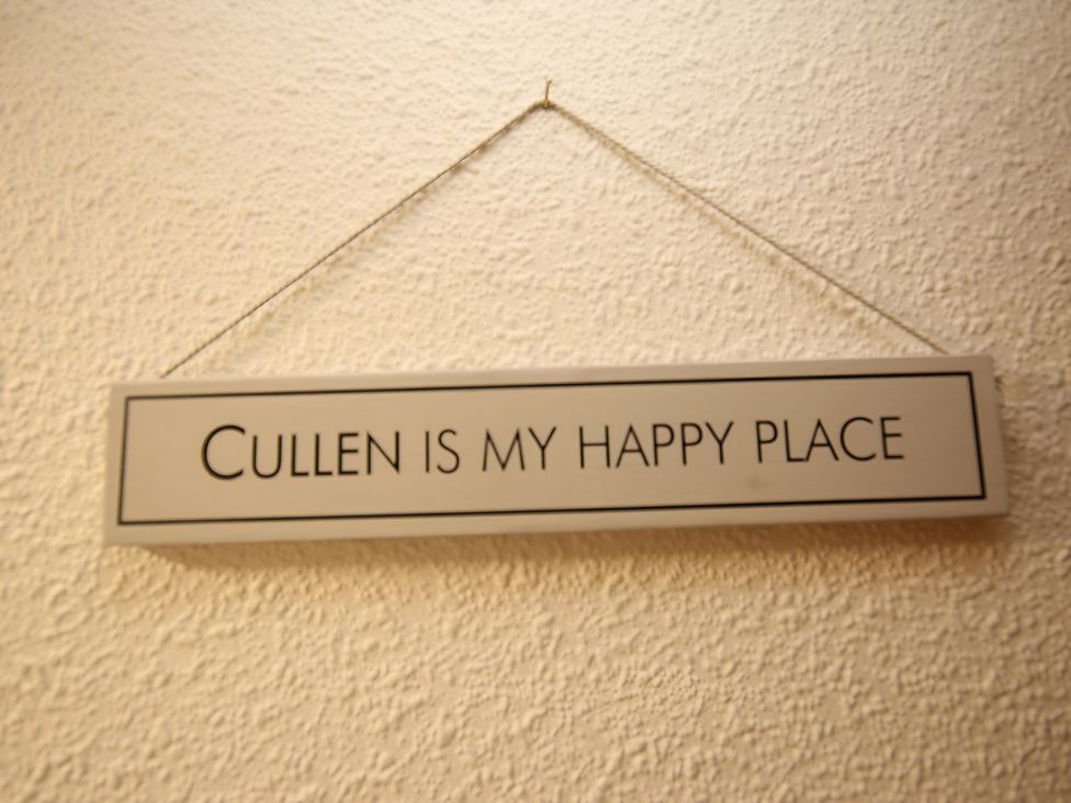 A sign that reads 'Cullen is my happy place' at Zen Cottage in Buckie