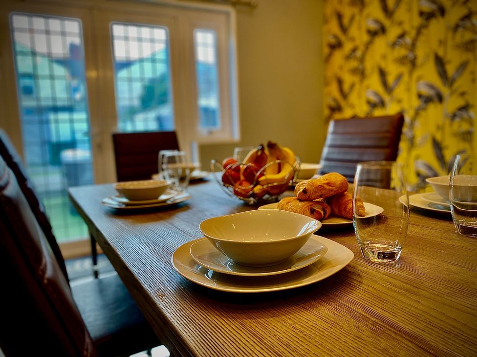 A dining room with table set for breakfast at 1 Horncliffe Road Blackpool