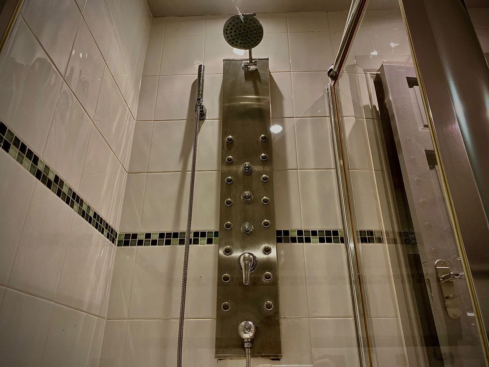 A shower system with a panel and showerhead at 1 Horncliffe Road Blackpool