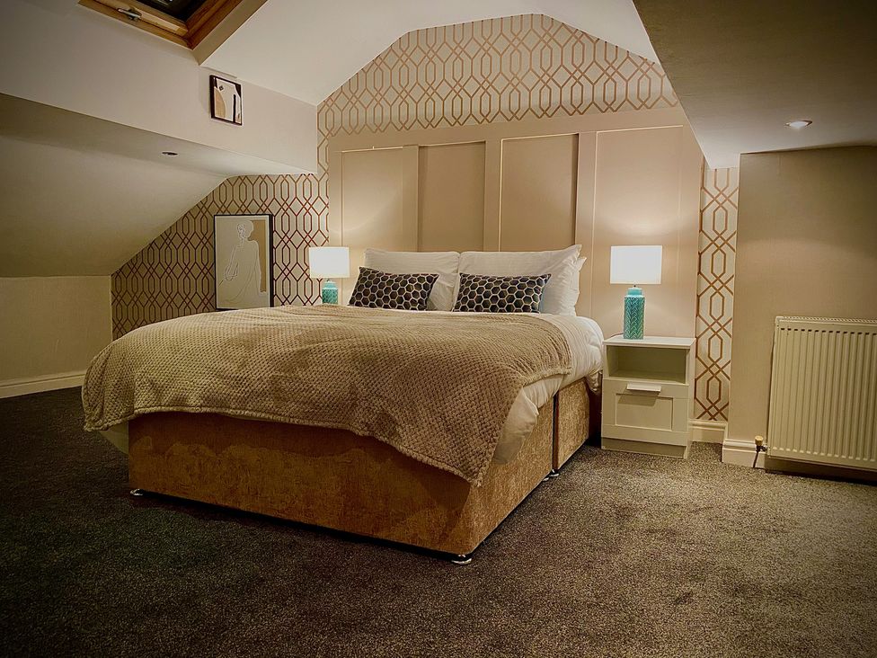 A bedroom with a bed and bedside table at 1 Horncliffe Road in Blackpool