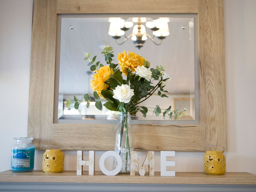 A display of flowers and decor on a shelf in Orchid 9 Christchurch