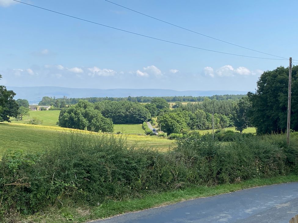 A landscape view with fields and trees at The Haven in Penrith