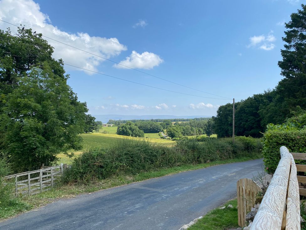 A view of a rural landscape with a road and trees at The Haven in Penrith