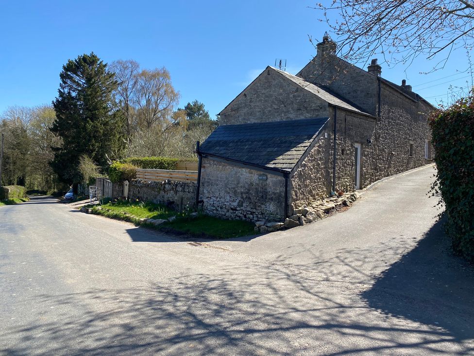 A house at a road intersection near trees at The Haven in Penrith