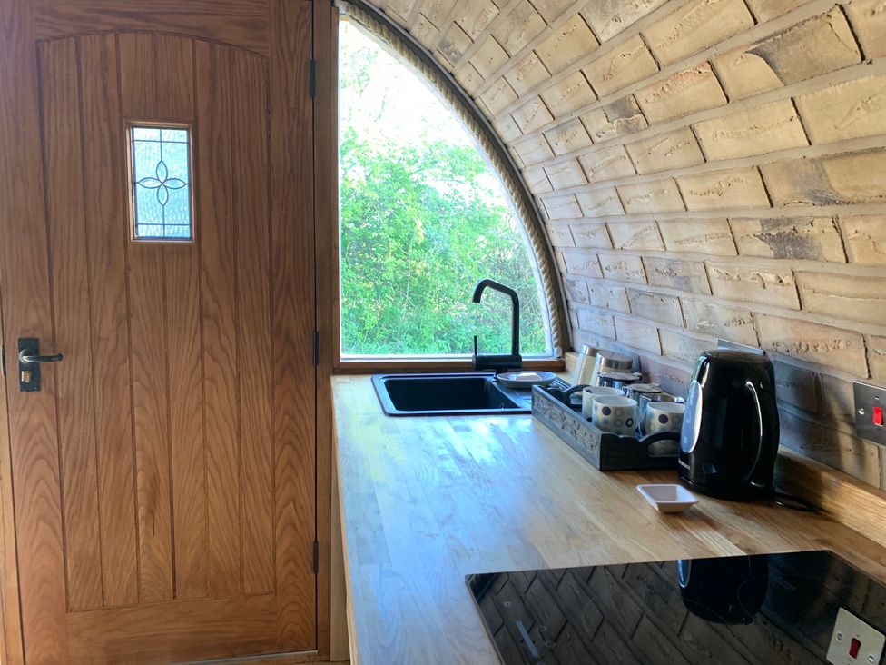 A kitchen with a sink and kettle at Cosy Escape in Sheerness