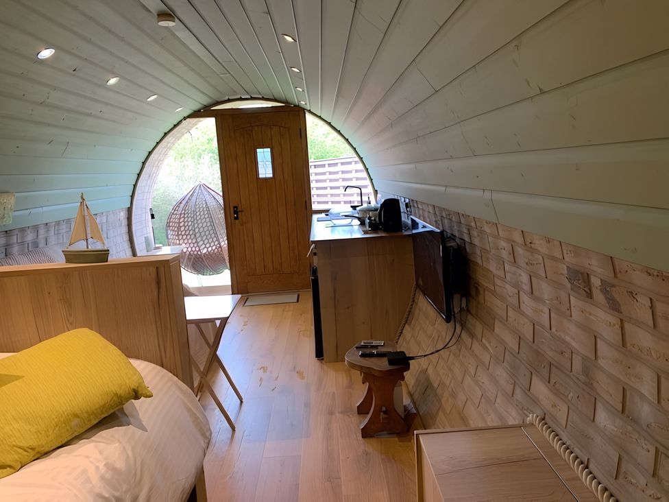 A bedroom with a bed and a door leading outside at Cosy Escape in Sheerness