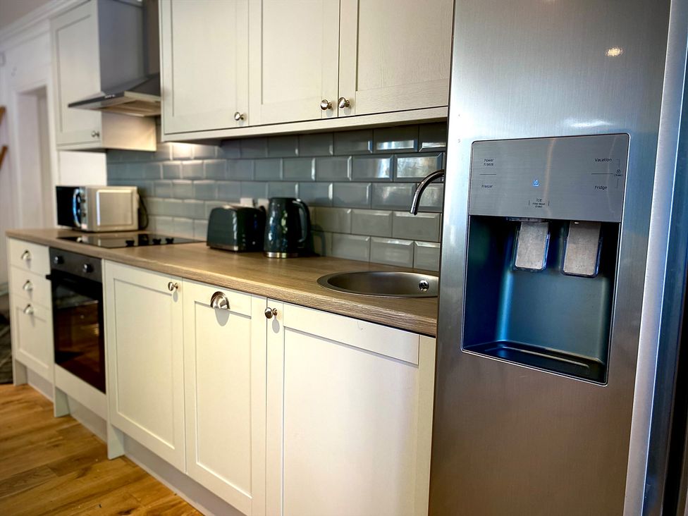 A kitchen with appliances and a countertop at Anchor Hot Tub Suite in Lytham St. Annes