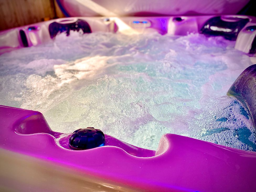 A hot tub with water and bubbles at Anchor Hot Tub Suite Lytham St. Annes