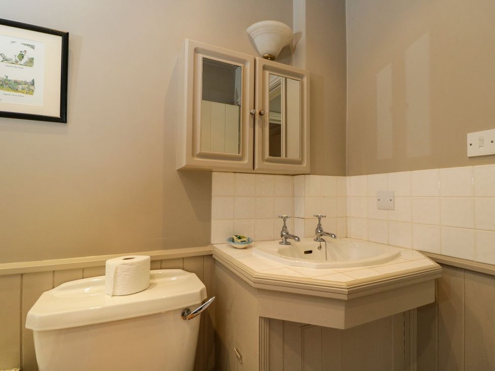 A bathroom with a sink and toilet at Foxhill Farm Barn Cheltenham