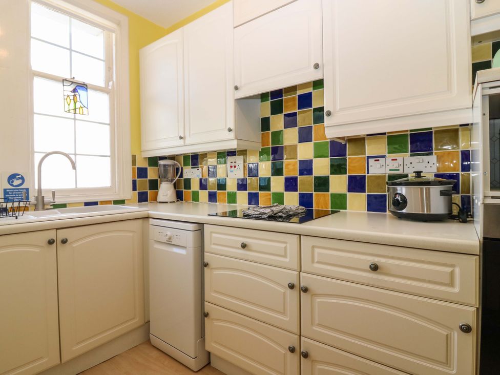 A kitchen with a sink and blender at The Lighthouse Retreat in St Abbs