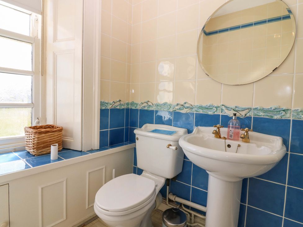 A bathroom with a sink and toilet at The Lighthouse Retreat in St Abbs