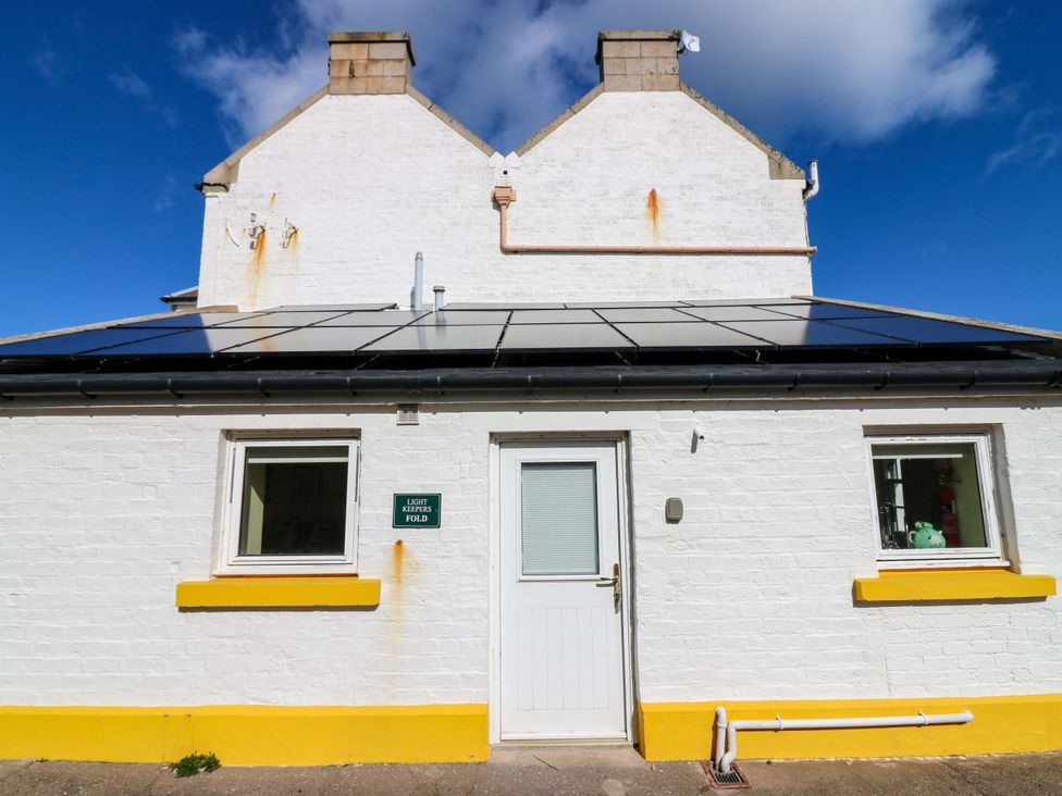 An exterior view of a house with solar panels at Keepers Fold at The Lighthouse St Abbs
