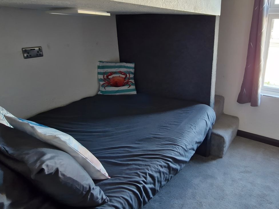 A bedroom with a bed and pillows at Waterside Lodge in Mablethorpe