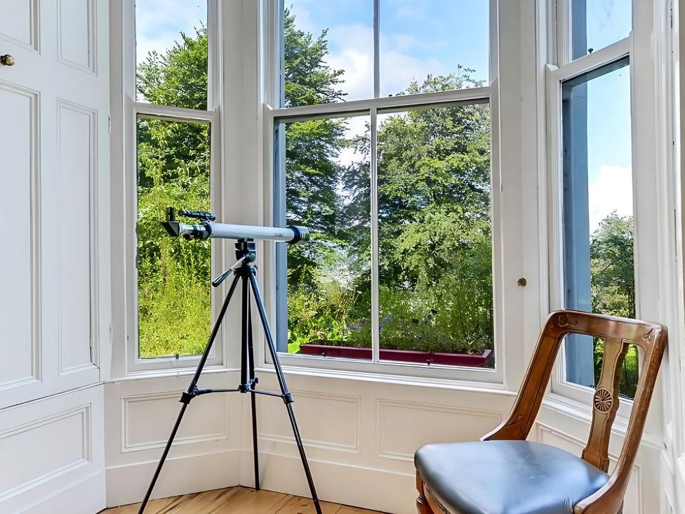 A study with a telescope and chair at Fountain Hill House Londonderry