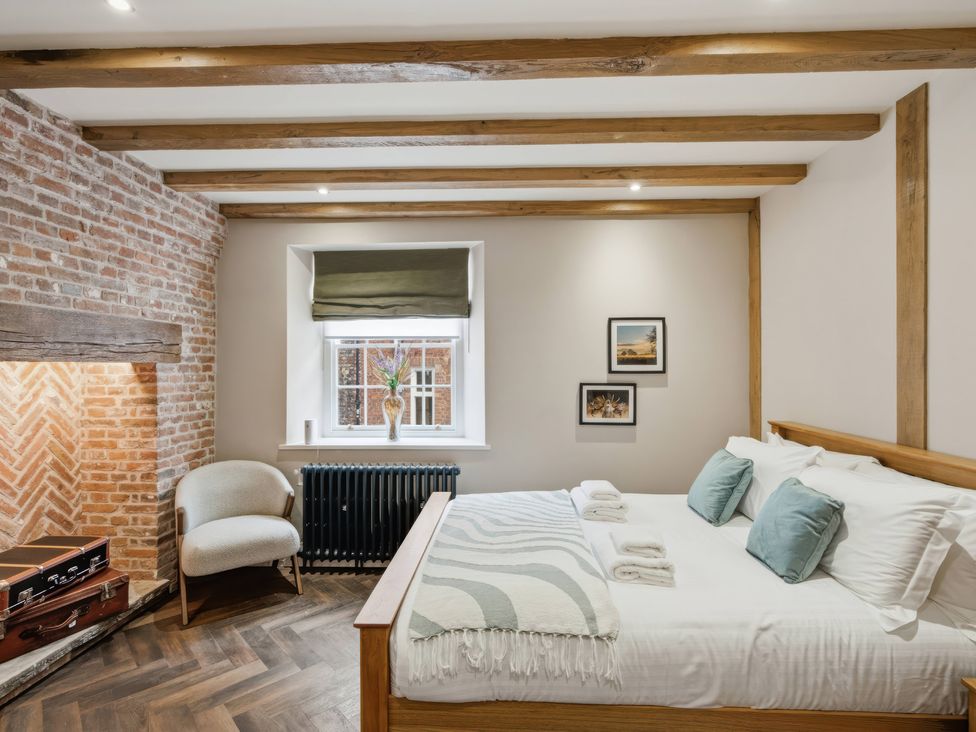 A bedroom with a bed and chair at Apt.1 in 