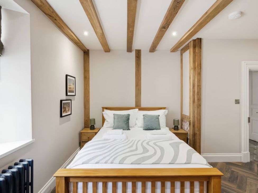 A bedroom with a bed and nightstand at Apt.1 