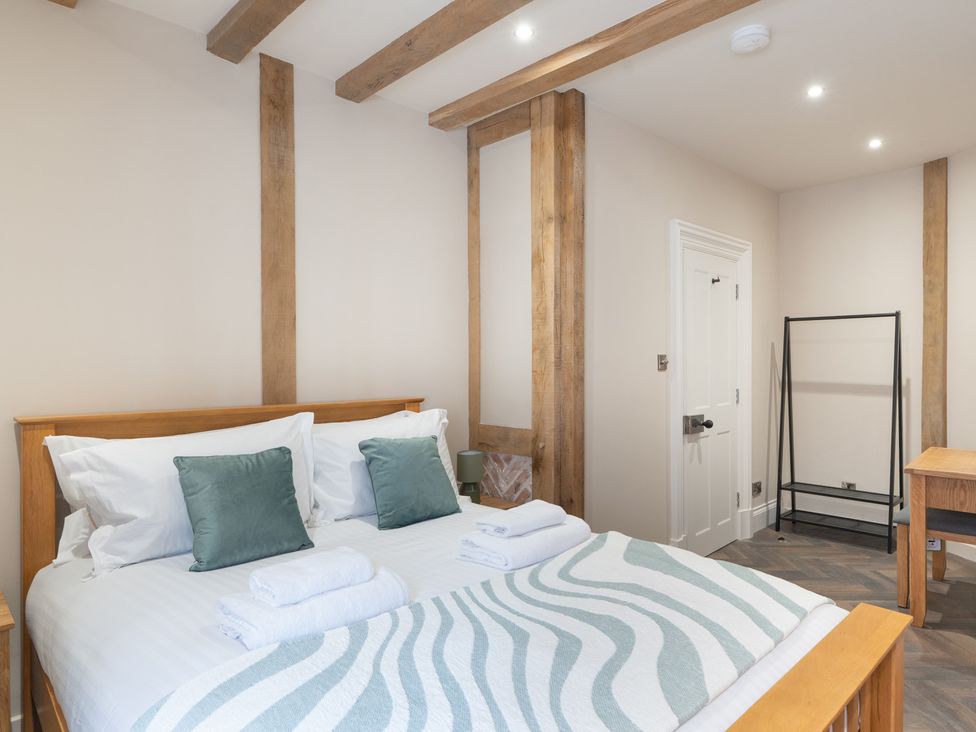 A bedroom with a bed and towels on it at Apt.1 in 