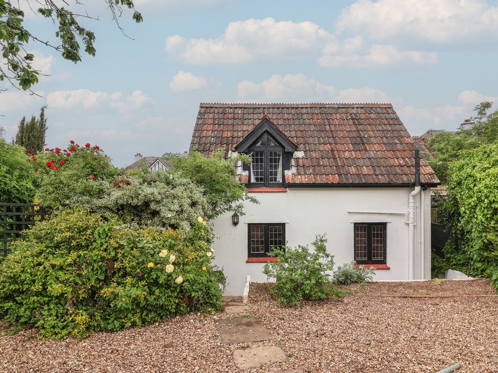 A house with windows and a garden at The Olde Forge Minehead