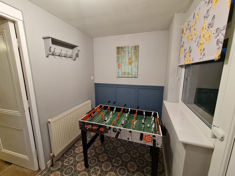A games room with a foosball table at Sea view cottage Penmaenmawr