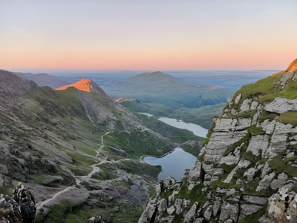 A scenic view of mountains and a lake at Sea view cottage Penmaenmawr