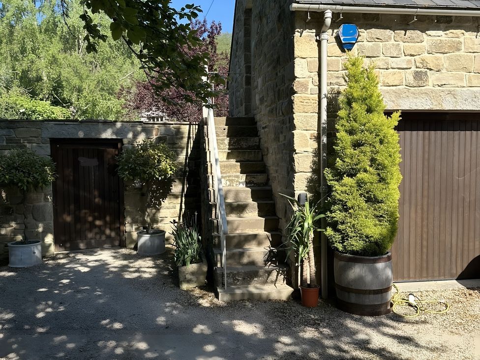 A building with stairs and a door at Hope Valley - Studio in Hope Valley