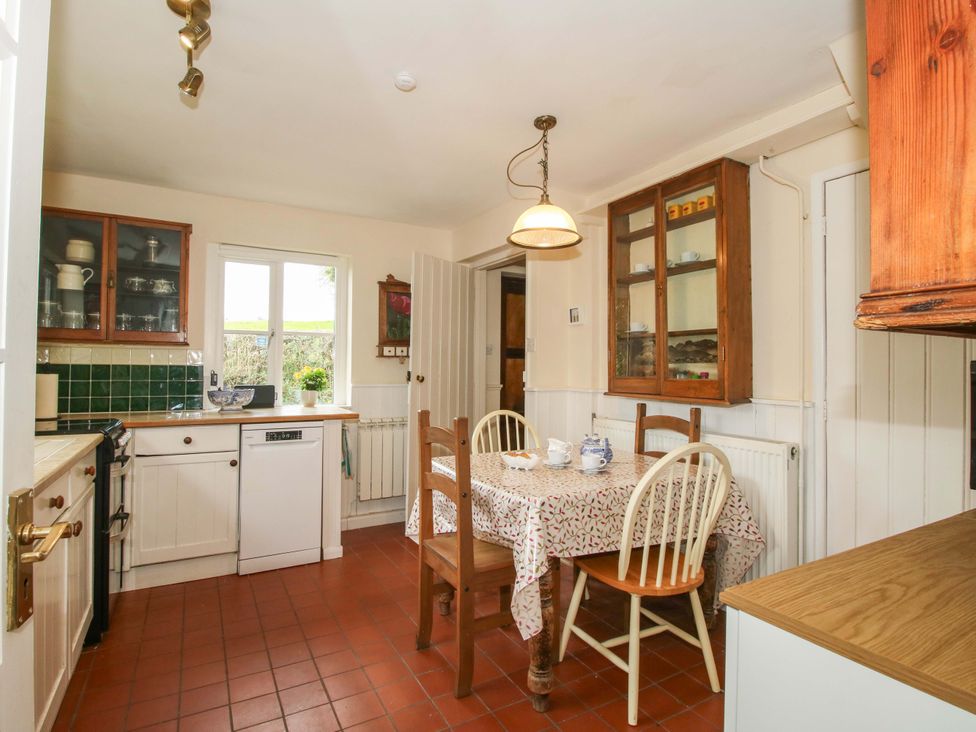 A kitchen with a table and chairs at Cardington 25
