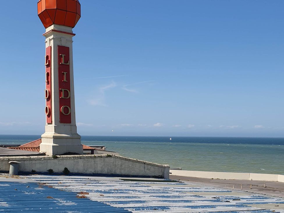 A Lido sign overlooking the ocean at an unidentified location