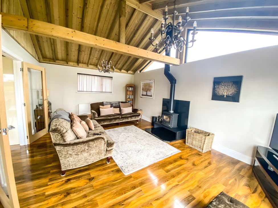 A living room with a sofa and coffee table at Fox Lodge York