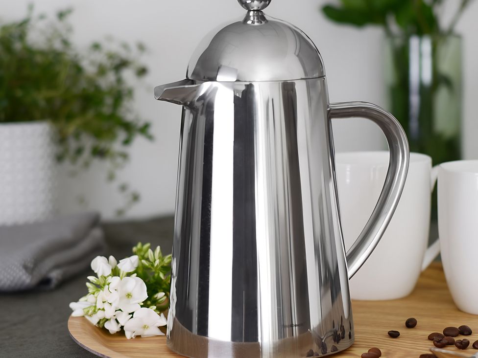 A coffee pot and cups on a wooden tray at Loxley Barn in Tring