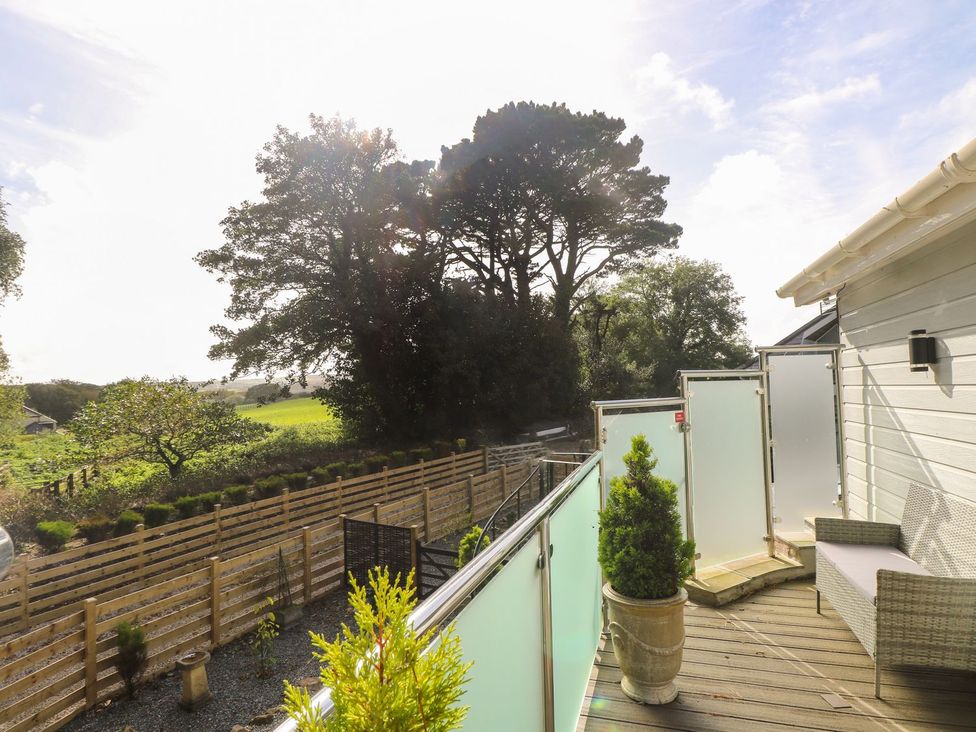 A garden with a balcony view at The Old Well House in Redruth
