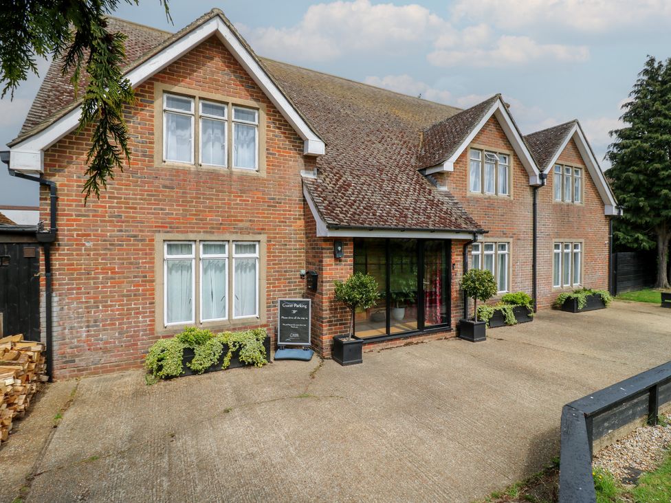 A house exterior with windows and planters at Denmark House in Chatham, Kent