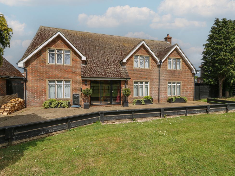A house with windows and a door in the garden at Denmark House in Chatham, Kent