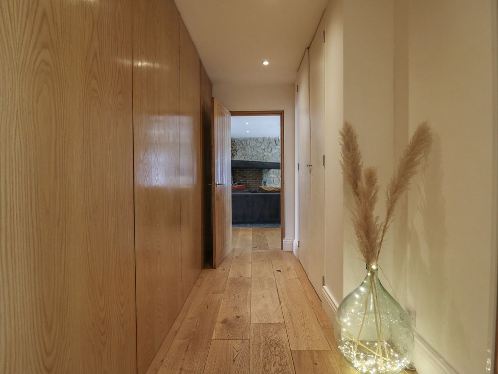 A hallway with wooden panels and a vase at Denmark House, Chatham, Kent