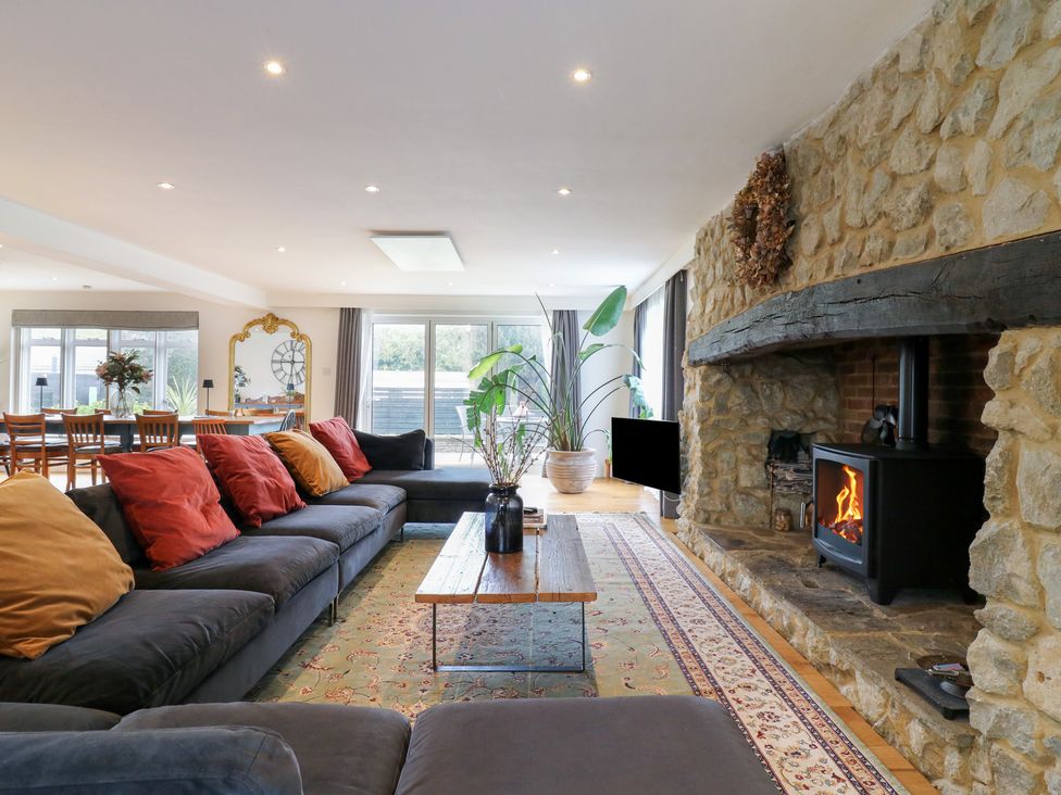 A living room with a sofa and fireplace at Denmark House in Chatham, Kent